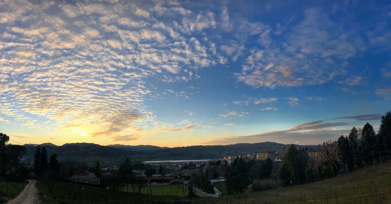 sky, mountain, architecture, cloud - sky, built structure, building exterior, no people, scenics, tranquility, beauty in nature, landscape, outdoors, tree, nature, tranquil scene, sunset, mountain range, day