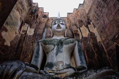 Low angle view of buddha statue