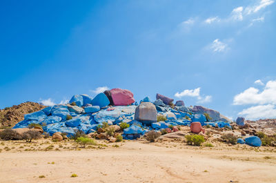 Built structure on sand against blue sky