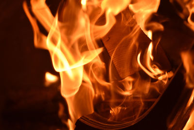 Close-up of fire burning at night