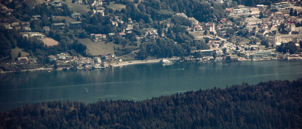 Scenic view of lake by buildings in town