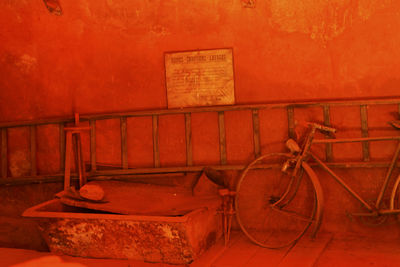 Old rusty bicycle against wall