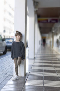 Girl standing in corridor