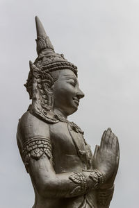 Low angle view of statue against sky