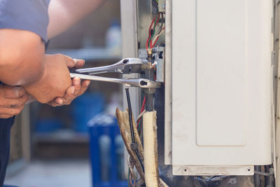 Man working on metal grate