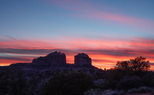 View of landscape against sunset sky