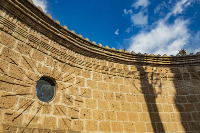 Low angle view of historical building against sky