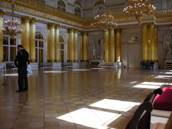 People in illuminated building