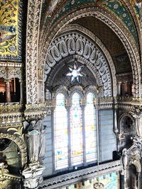 Low angle view of ornate window on building