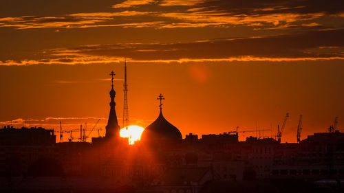 Silhouette of temple against sky during sunset