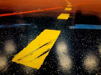 High angle view of raindrops on road