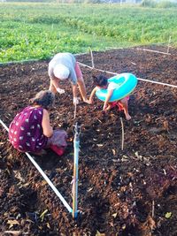 High angle view of girl working on field