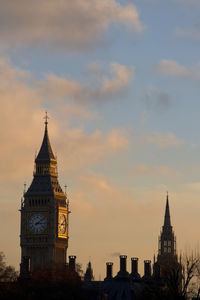 Big ben and palace of westminster tower against sky