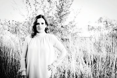 Woman standing on snow covered field