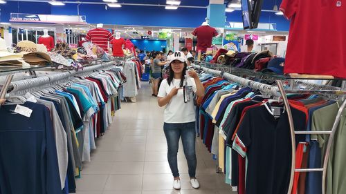 Full length of woman standing in store