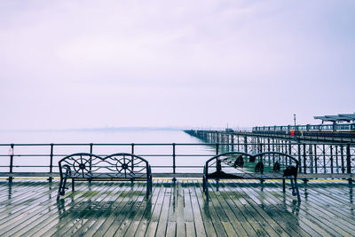 Pier over sea against sky