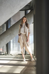 Full length of young woman walking outdoors