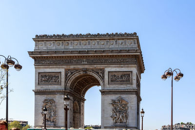 Low angle view of triumphal arch against sky