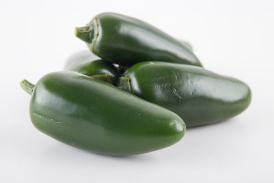 Close-up of green pepper against white background