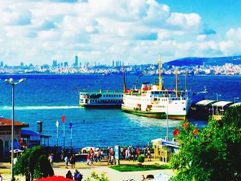 View of harbor against cloudy sky