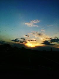 Silhouette landscape against sky at sunset