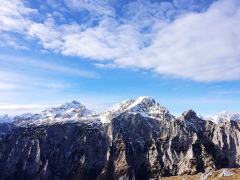 Scenic view of snow mountains against sky