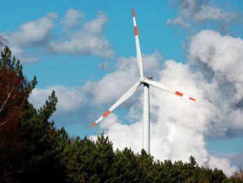 Low angle view of wind turbine against sky