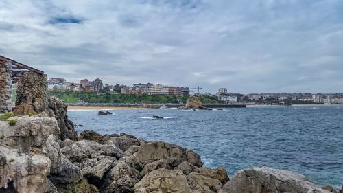 View of buildings against cloudy sky