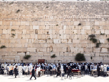 Group of people in front of historic building