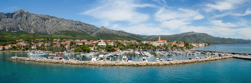 Panoramic view of sea and buildings against sky