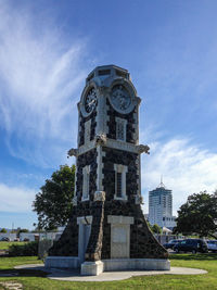 Low angle view of clock tower against sky