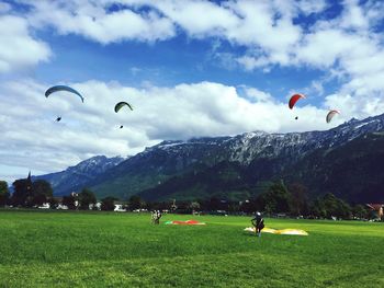 Scenic view of mountains against cloudy sky