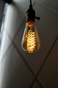 Low angle view of illuminated light bulb