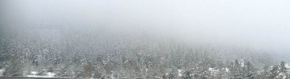 Snow covered landscape against sky