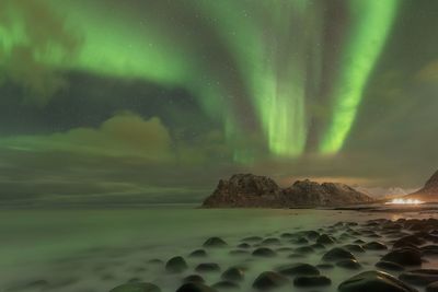 Scenic view of sea against sky at night