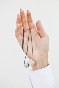 Close-up of hand against white background