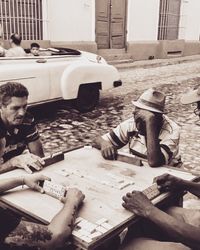 High angle view of people working on table