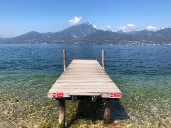 Pier over sea against sky