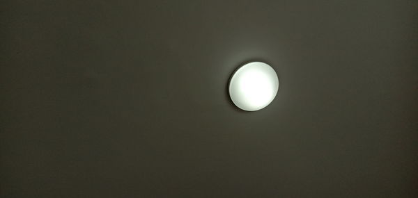 Low angle view of illuminated light bulb