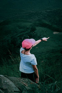 Rear view of woman on field