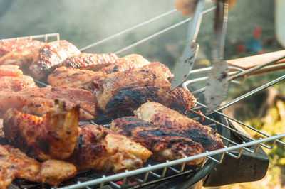 Close-up of meat on barbecue grill