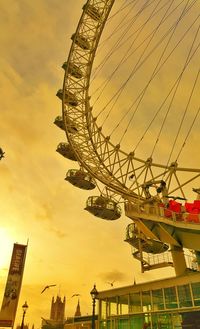 Low angle view of ferris wheel against sky