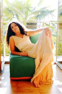 Portrait of a young woman sitting outdoors