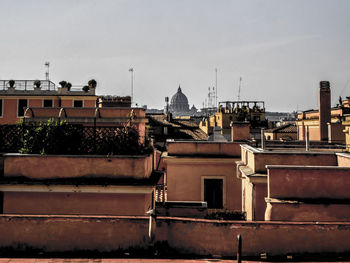 Houses against sky in city