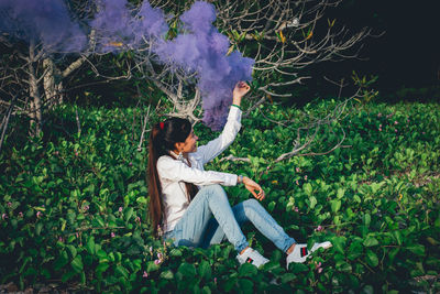 Woman sitting on field