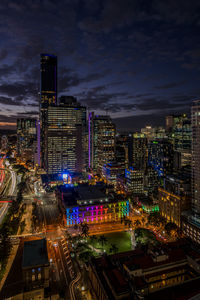 High angle view of illuminated buildings in city at night
