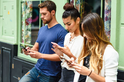 Young couple using mobile phone