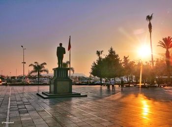 Silhouette statue against sky during sunset