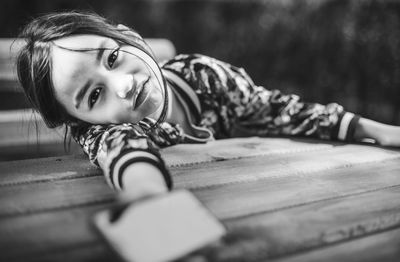 Portrait of smiling young woman lying down