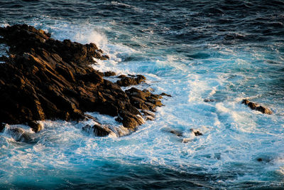 Scenic view of rocks in sea